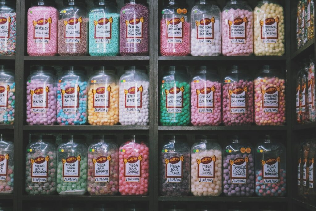a shelf filled with lots of different types of candy